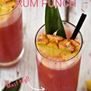Bright pink punch served in tall glasses garnished with pineapple leaves and wedges and title graphic across the top.