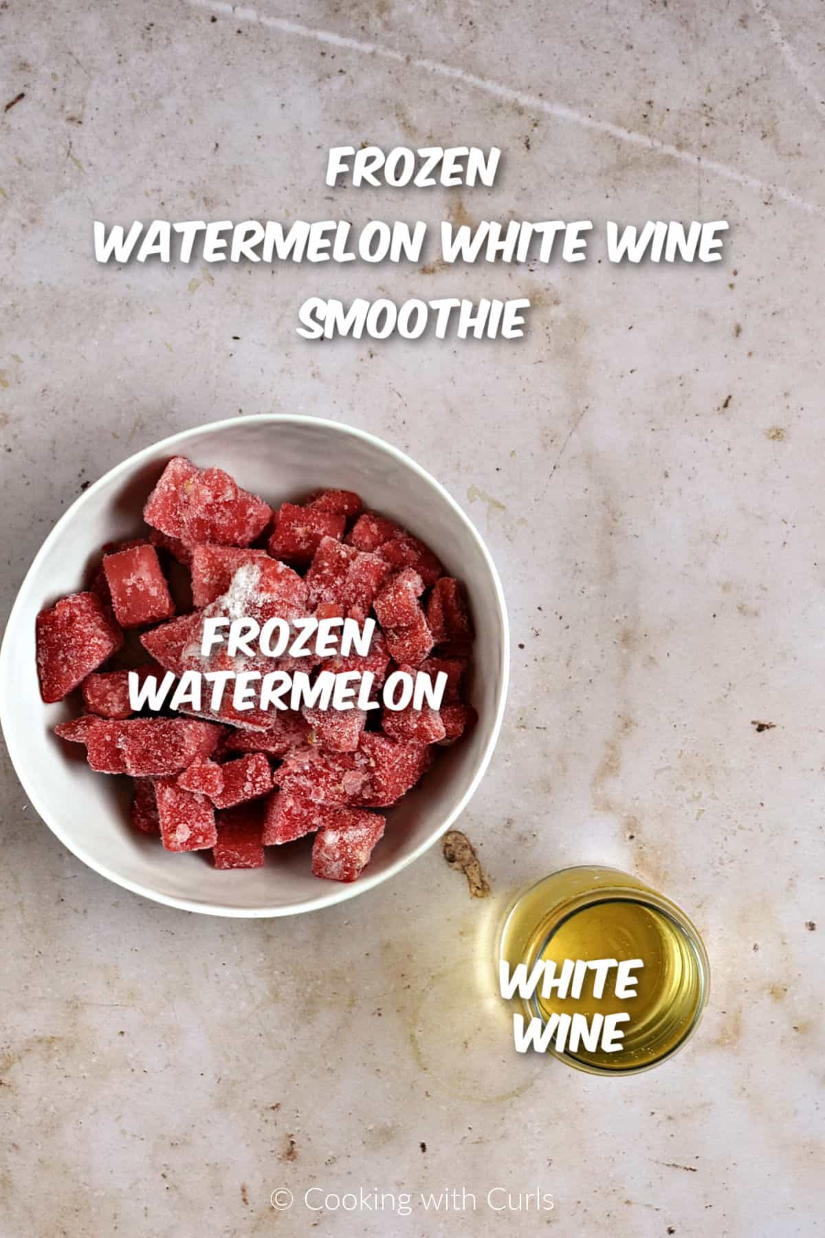 Frozen watermelon chunks and white wine to make watermelon white wine smoothie. 