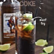 Two tall glasses filled with dark rum, cola, and ice cubes with a lime wedge garnish and title graphic across the top.