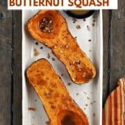 Looking down on two butternut squash halves topped with maple syrup and chopped pecans and butter with brown sugar with title graphic across the top.