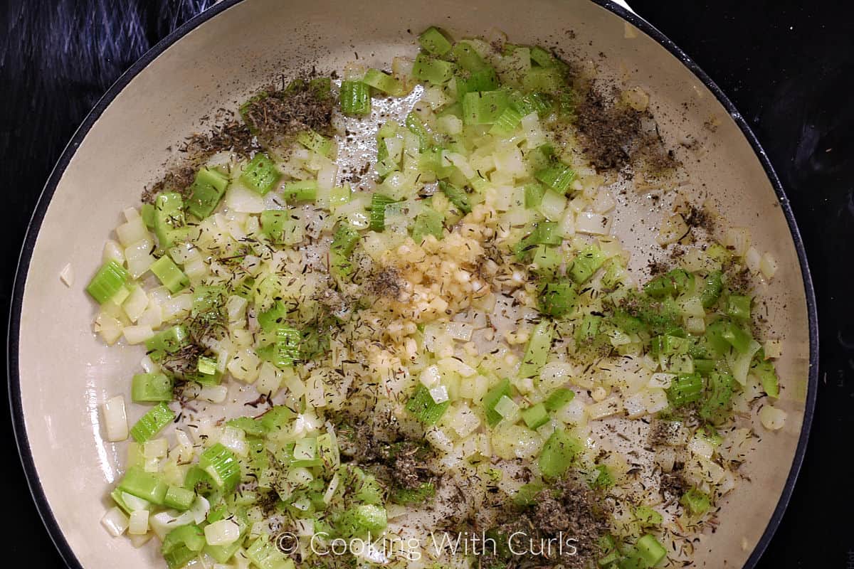 Minced onion, celery, garlic, and dried herbs in a large skillet. 