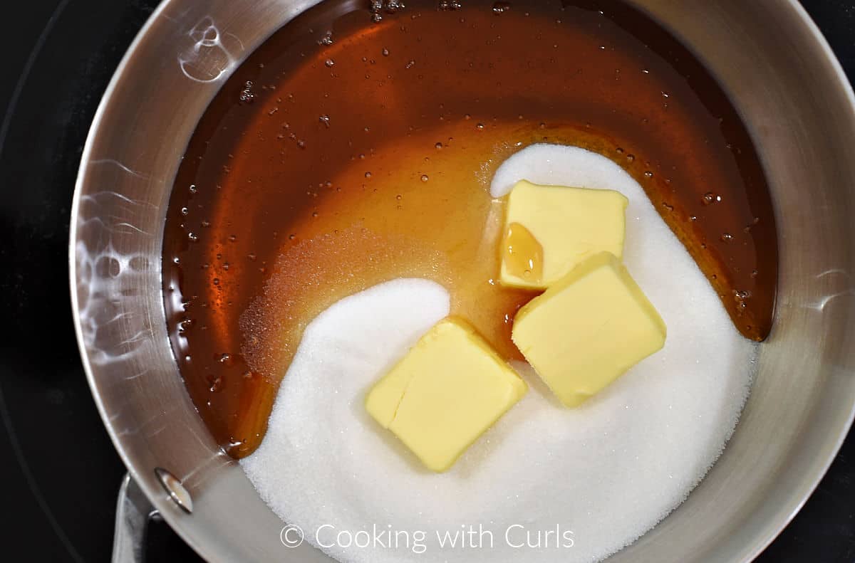 Butter, honey, and sugar in a saucepan. 