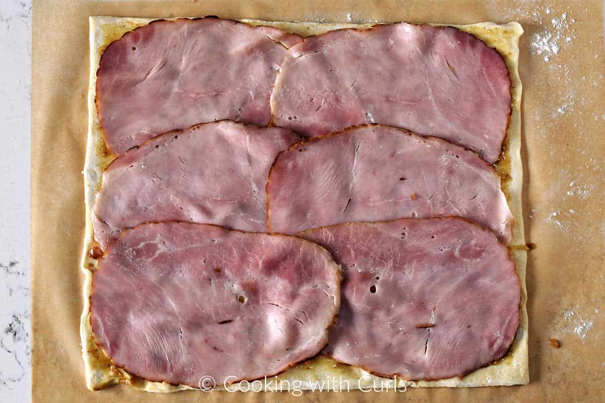 Six-slices-of-ham-on-puff-pastry-sheet.