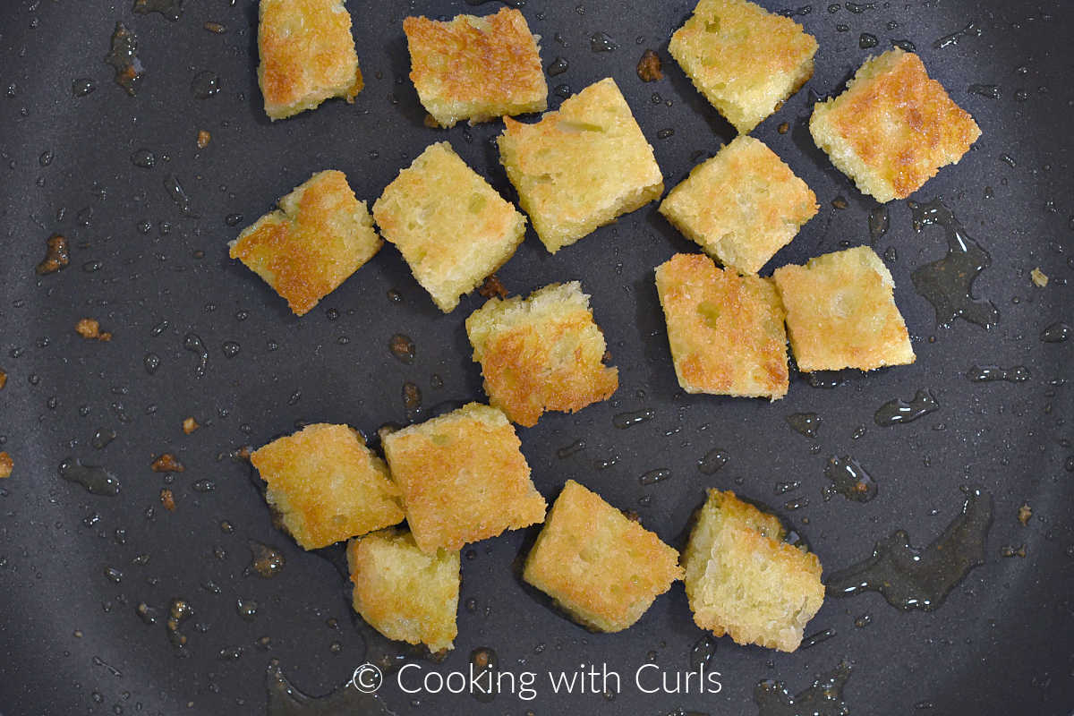 crispy-browned-crouton-cubes-in-skillet-with-oil.