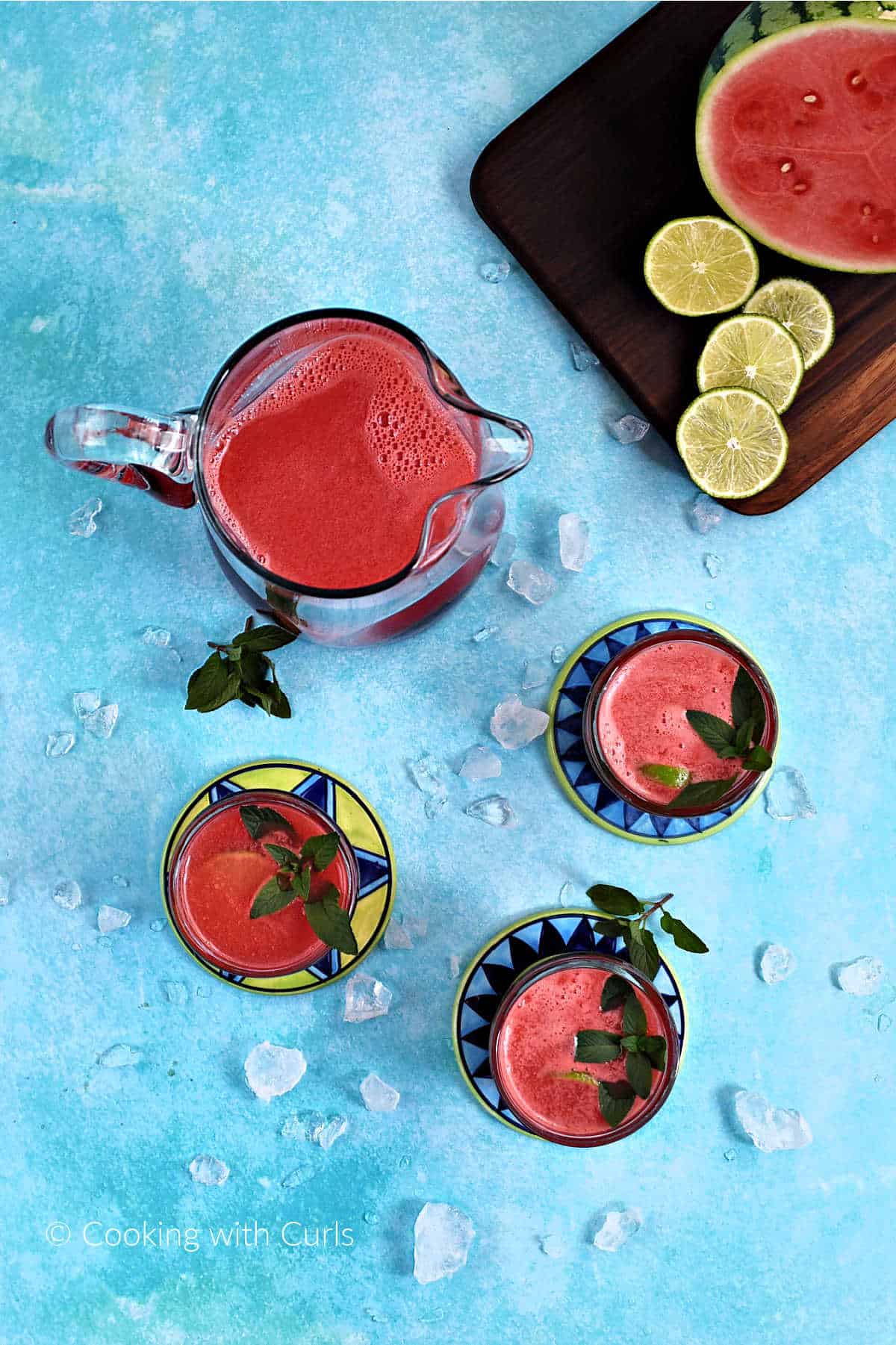 A-Pitcher-of-Watermelon-Agua-Fresca-with-three-glasses-on-coasters.