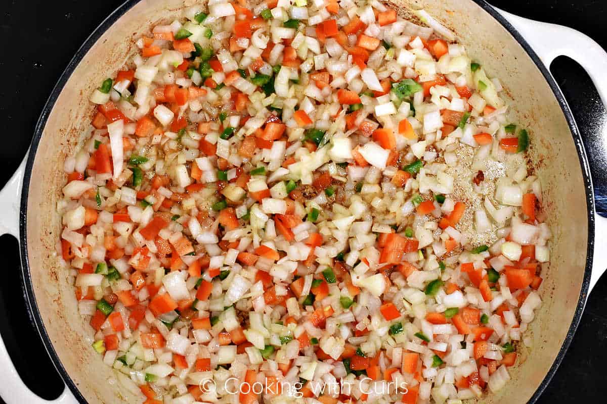 Diced onion, red pepper, and jalapeno in a large skillet.