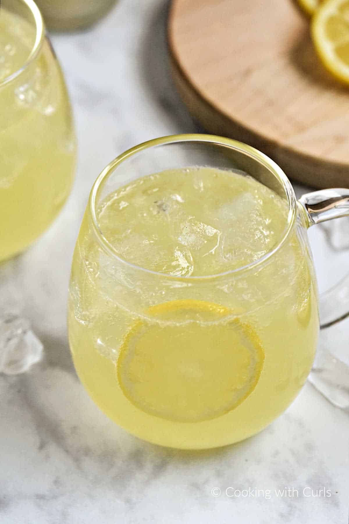 Limoncello Moscow Mule in a glass mug with ice and lemon wheel garnish.