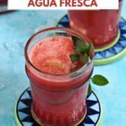 Two-glasses-of-watermelon-agua-fresca-with-lime-and-mint-sprig-and-title-graphic-across-the-top.