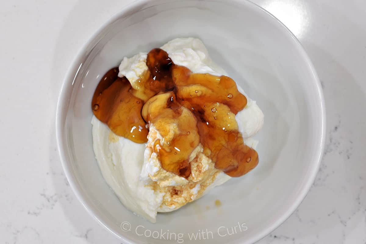 Yogurt, honey, and vanilla in a small bowl.