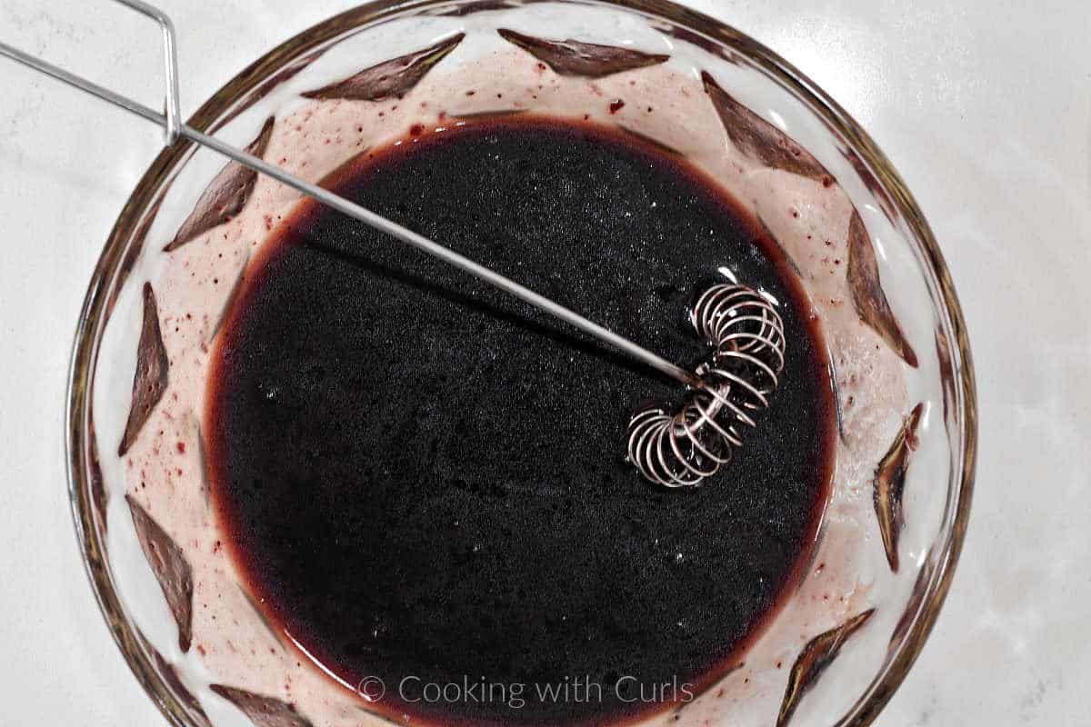 Blueberry vinaigrette whisked together in a small bowl.