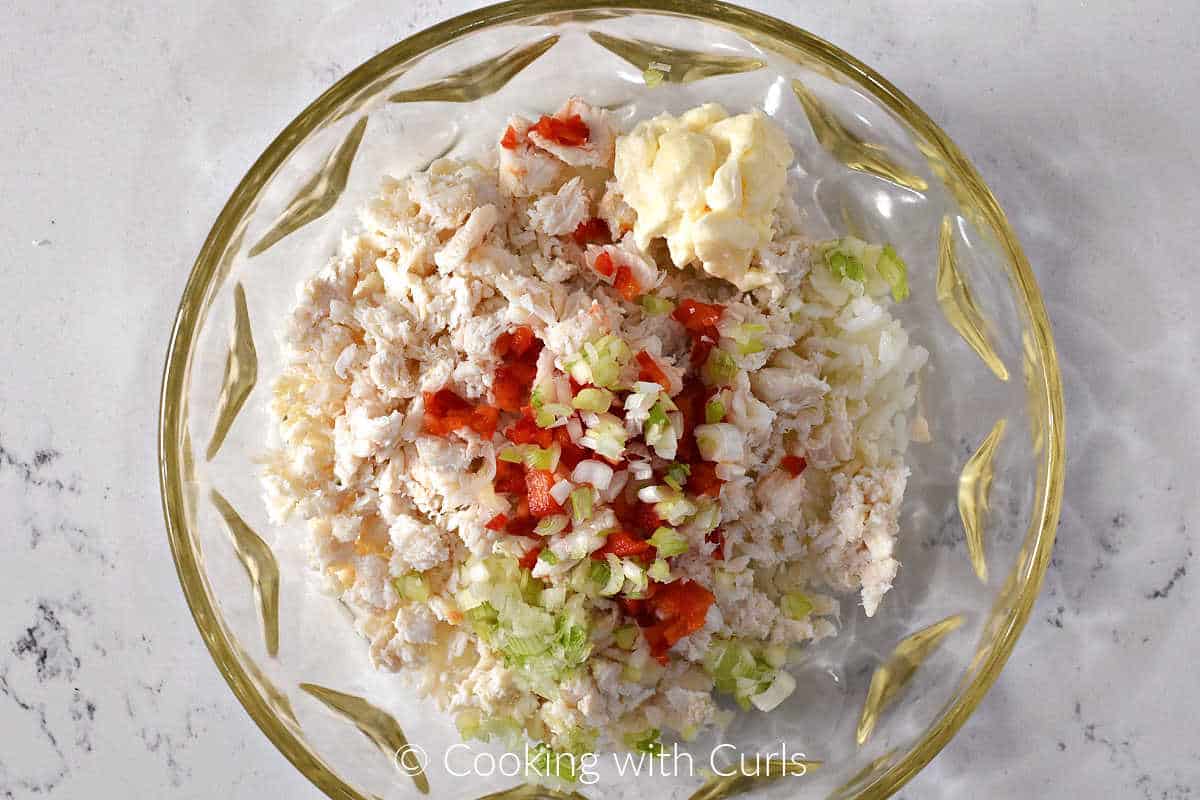 Lump crab, rice, onion, red pepper, and mayonnaise in a large bowl.
