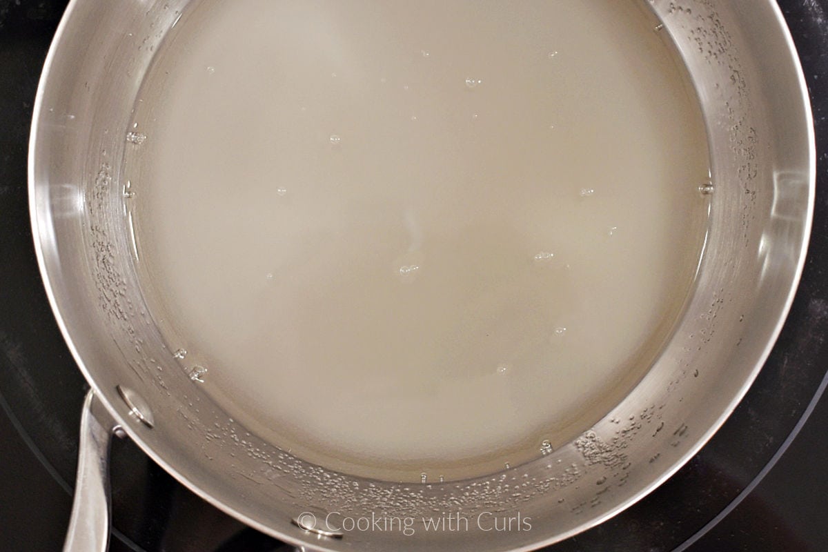 Water and sugar in saucepan.