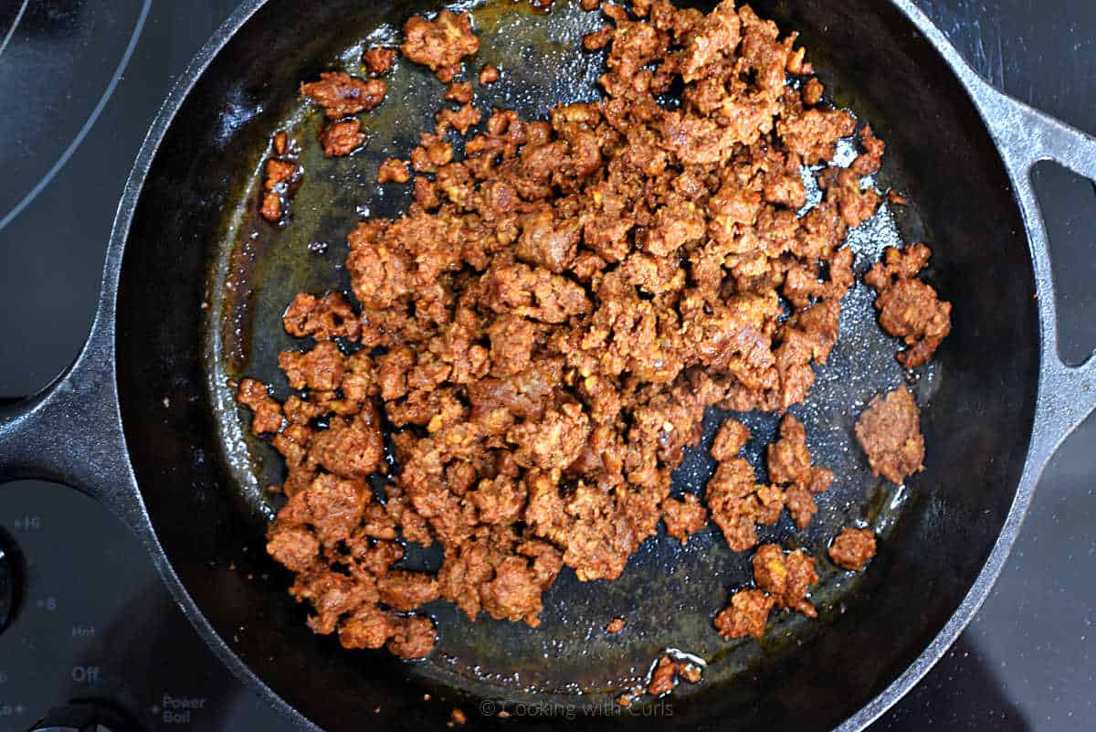 Cooked chorizo sausage in a cast iron skillet.