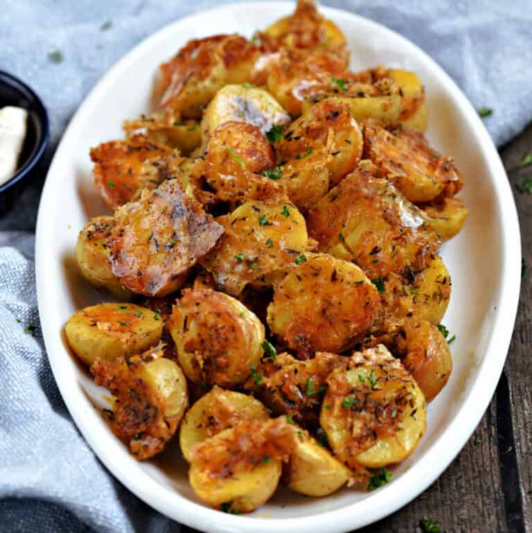 Parmesan roasted potatoes on an oval serving platter.