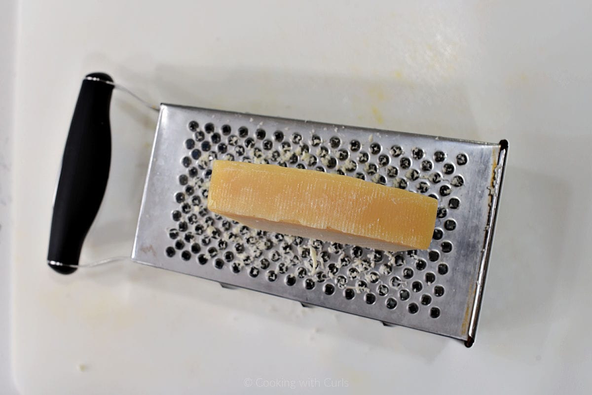Parmesan cheese grated on the smallest holes on a boxed grater.