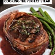 Bacon wrapped steak topped with red wine sauce and thyme sprigs with title graphic across the top.