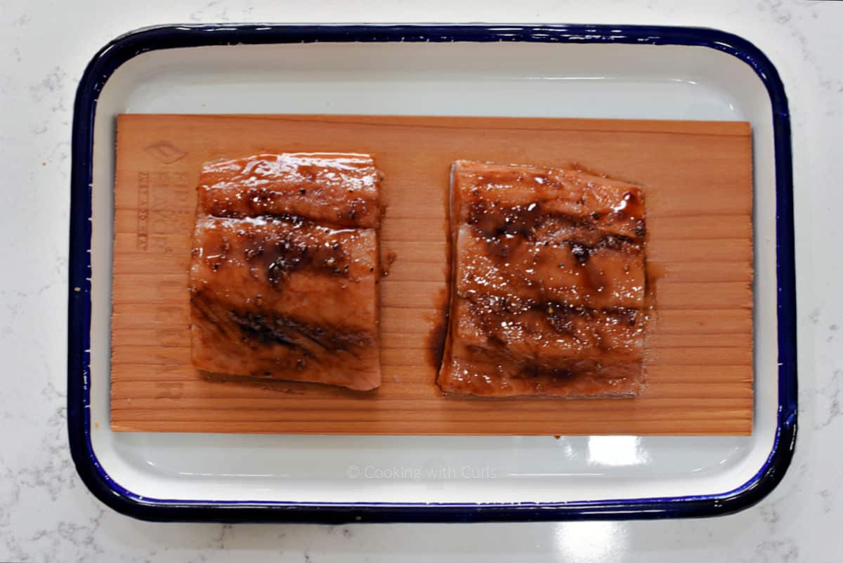 Two salmon filets brushed with maple glaze.