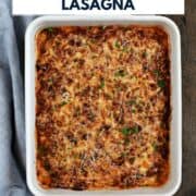 Zucchini lasagna in a ceramic baking dish with title graphic across the top.