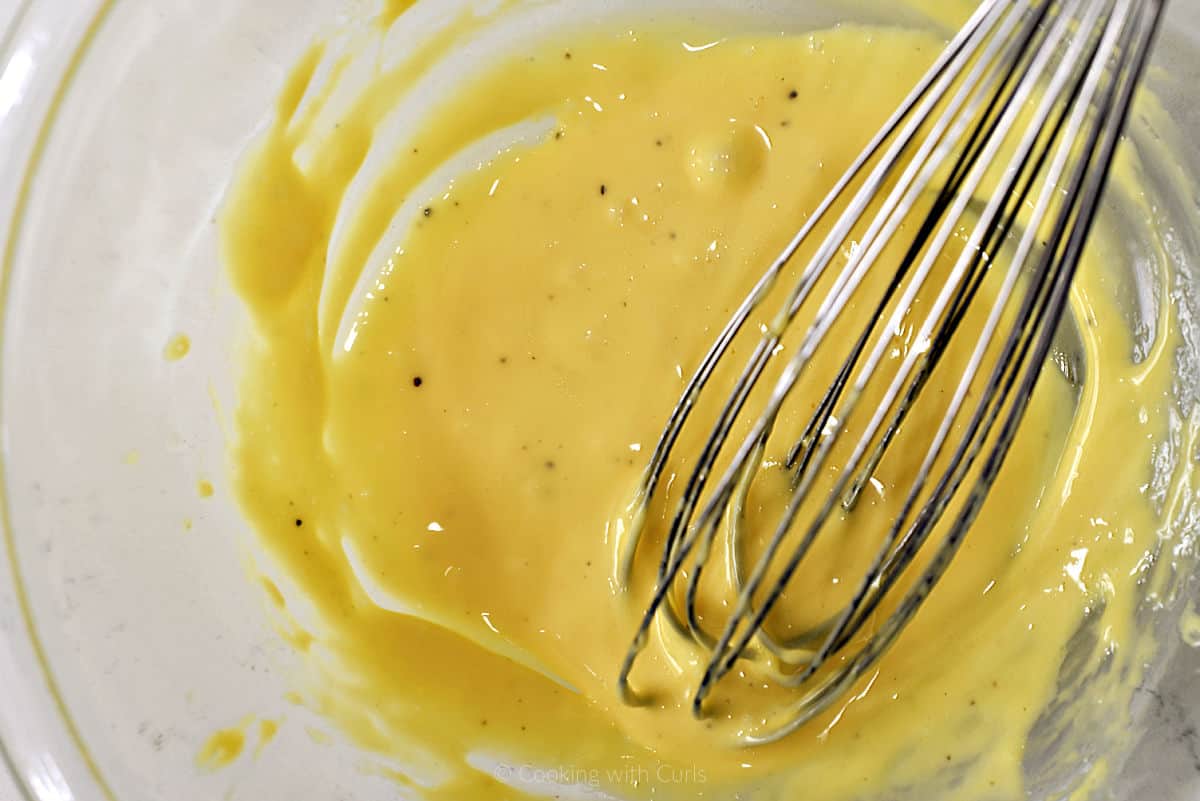 Aioli whisked together in a mixing bowl.