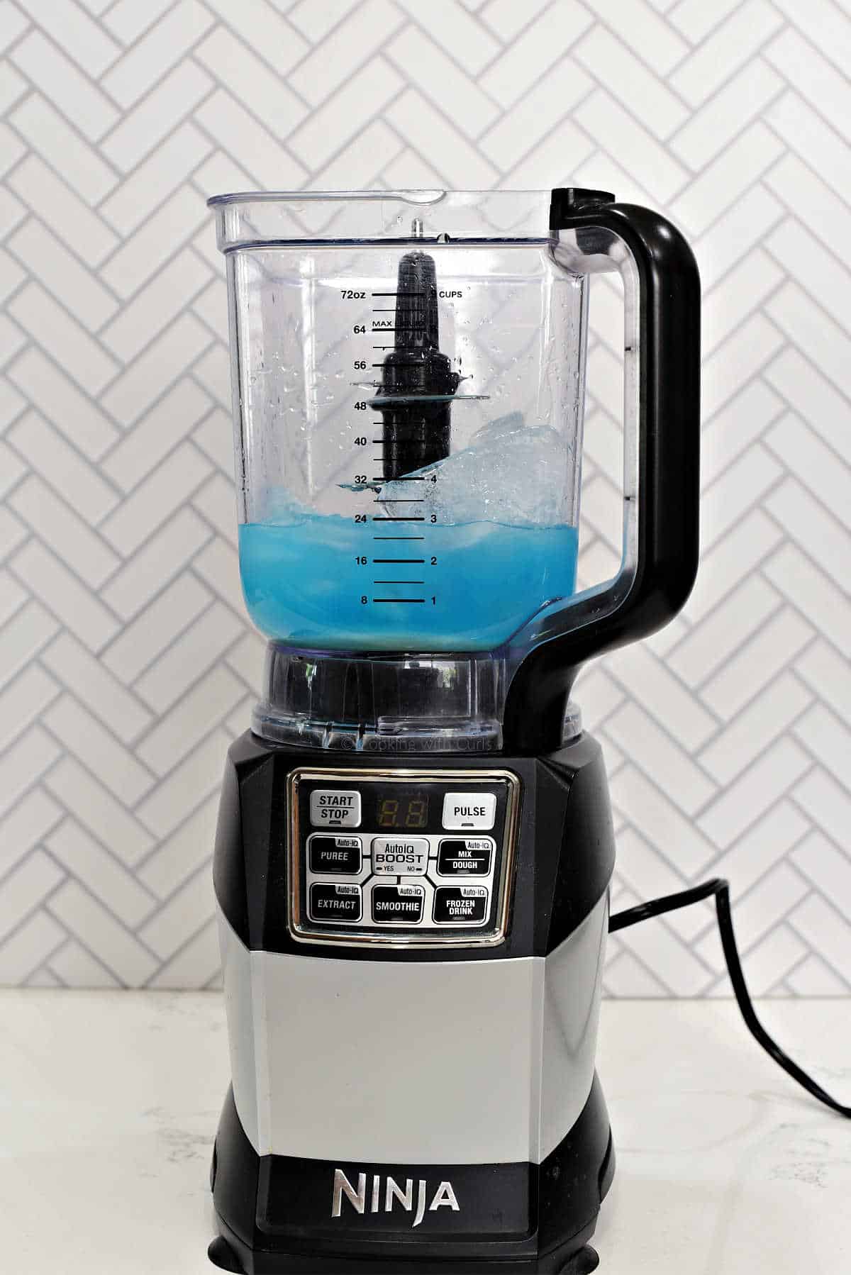 Blue Hawaiian ingredients in a blender.