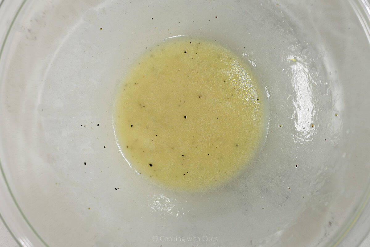 Lemon vinaigrette in a mixing bowl.