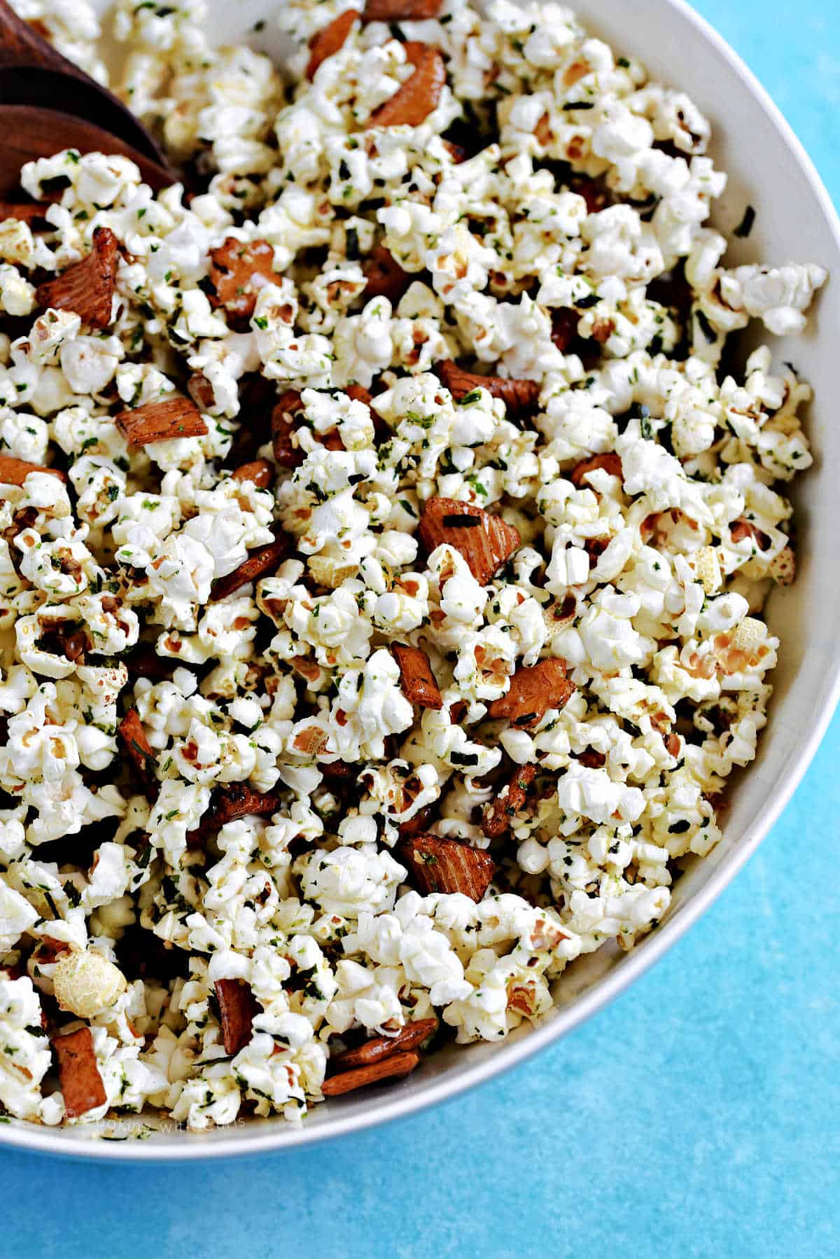 Furikake popcorn mixed with mochi crackers in a large bowl.