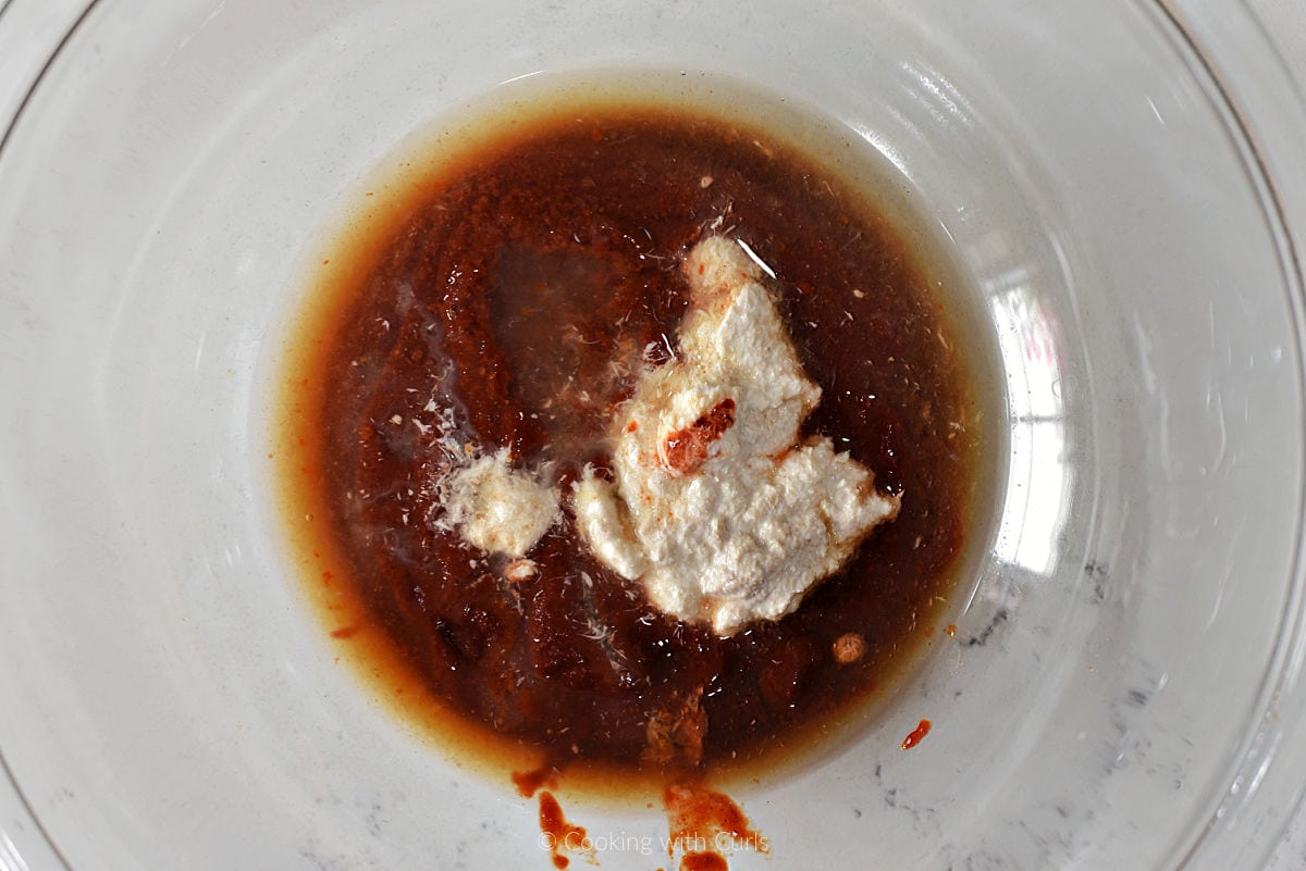 Shrimp cocktail sauce ingredients in a mixing bowl.