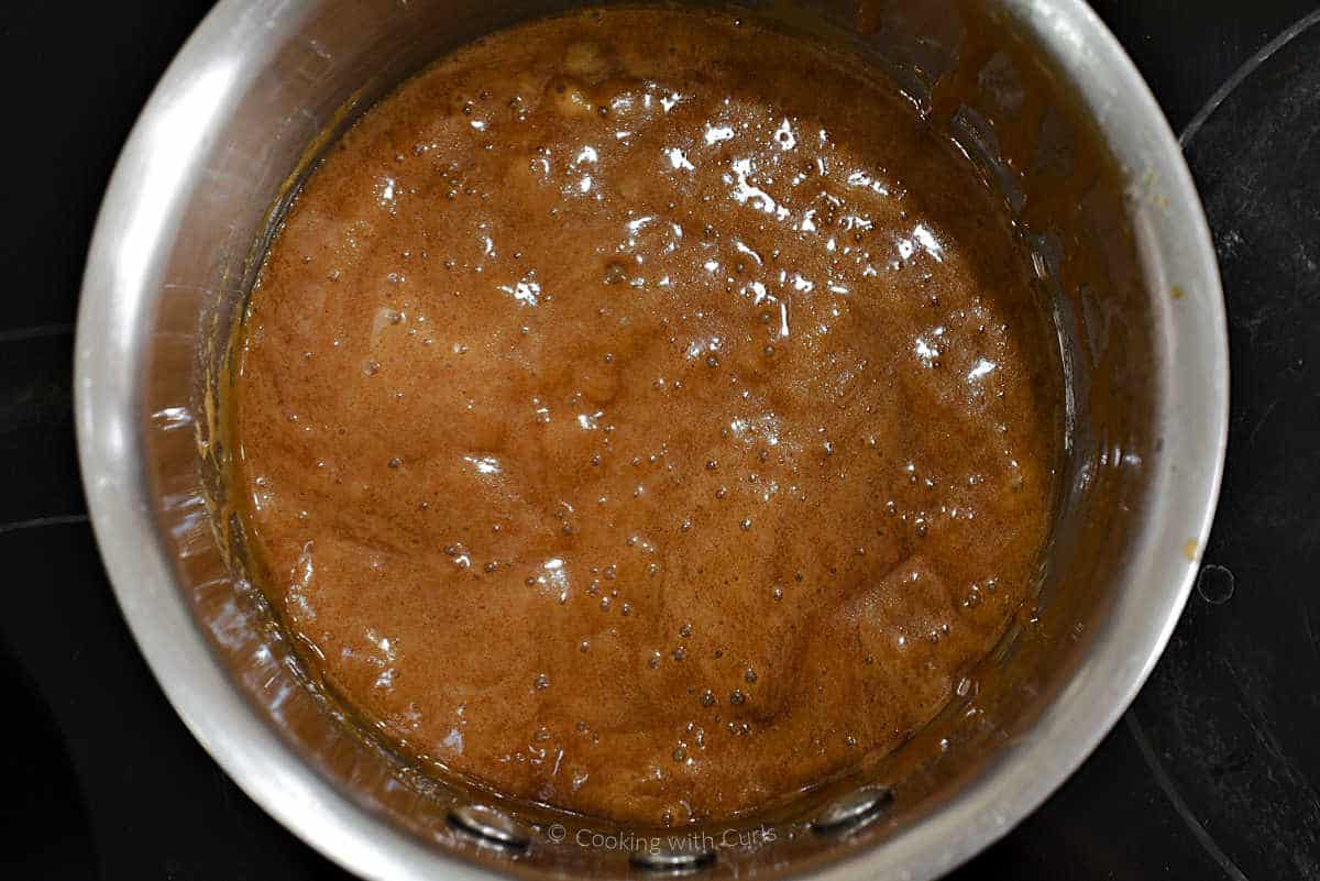 Caramel popcorn topping bubbling in a saucepan.