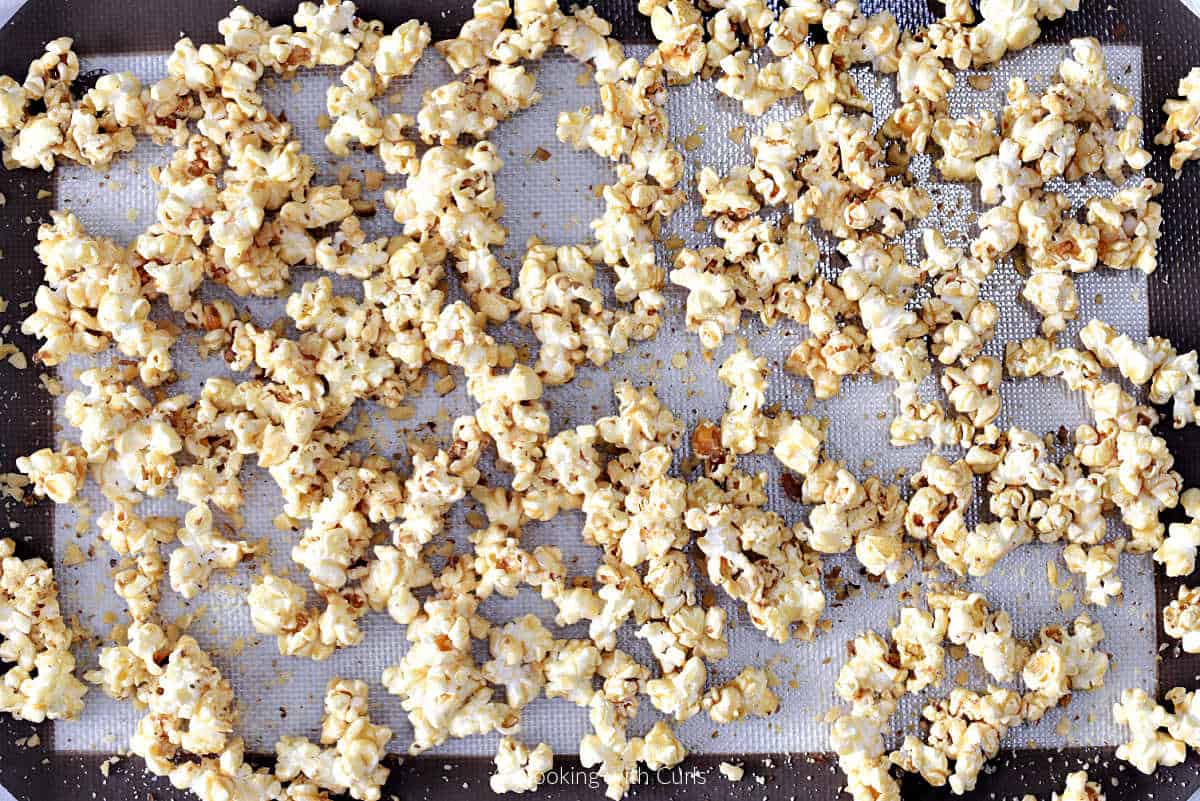 Baklava popcorn on a silicone lined baking sheet.