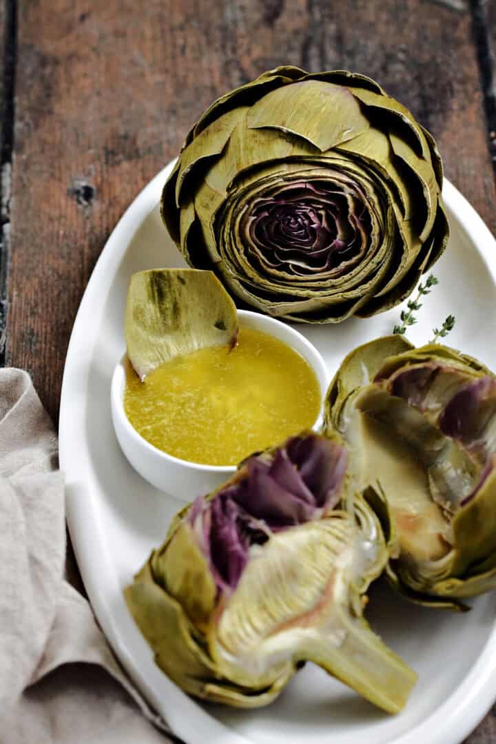 Steamed artichokes with garlic butter.