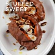 Two stuffed sweet potatoes topped with melted marshmallows and chopped pecans on a serving platter with title graphic across the top.