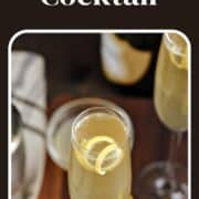 Yellow French 75 Cocktail in champagne flutes with lemon twist and title graphic across the top.