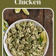 Chunks of chicken mixed with chimichurri sauce in a serving bowl with a lime wedge and fresh cilantro on the side and title graphic across the top.