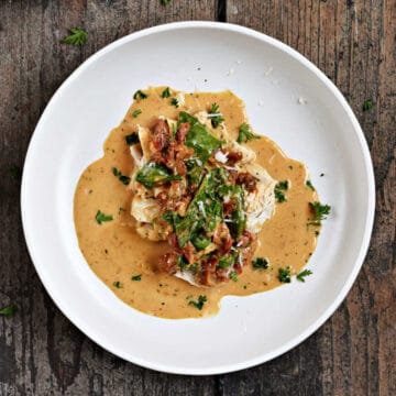 Chicken breast topped with sun-dried tomatoes, spinach, and creamy sauce.
