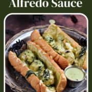 Meatballs with Alfredo sauce and spinach in hoagie rolls with title graphic across the top.