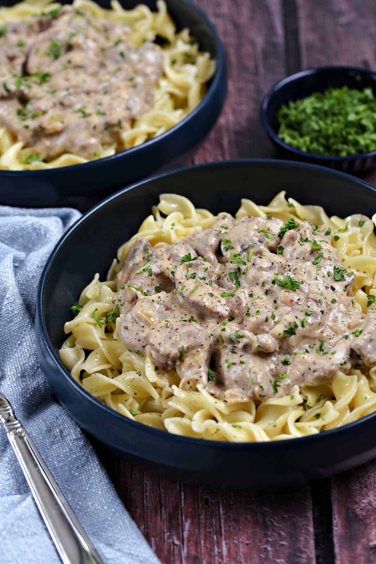 Creamy sliced beef on a bed of noodles.